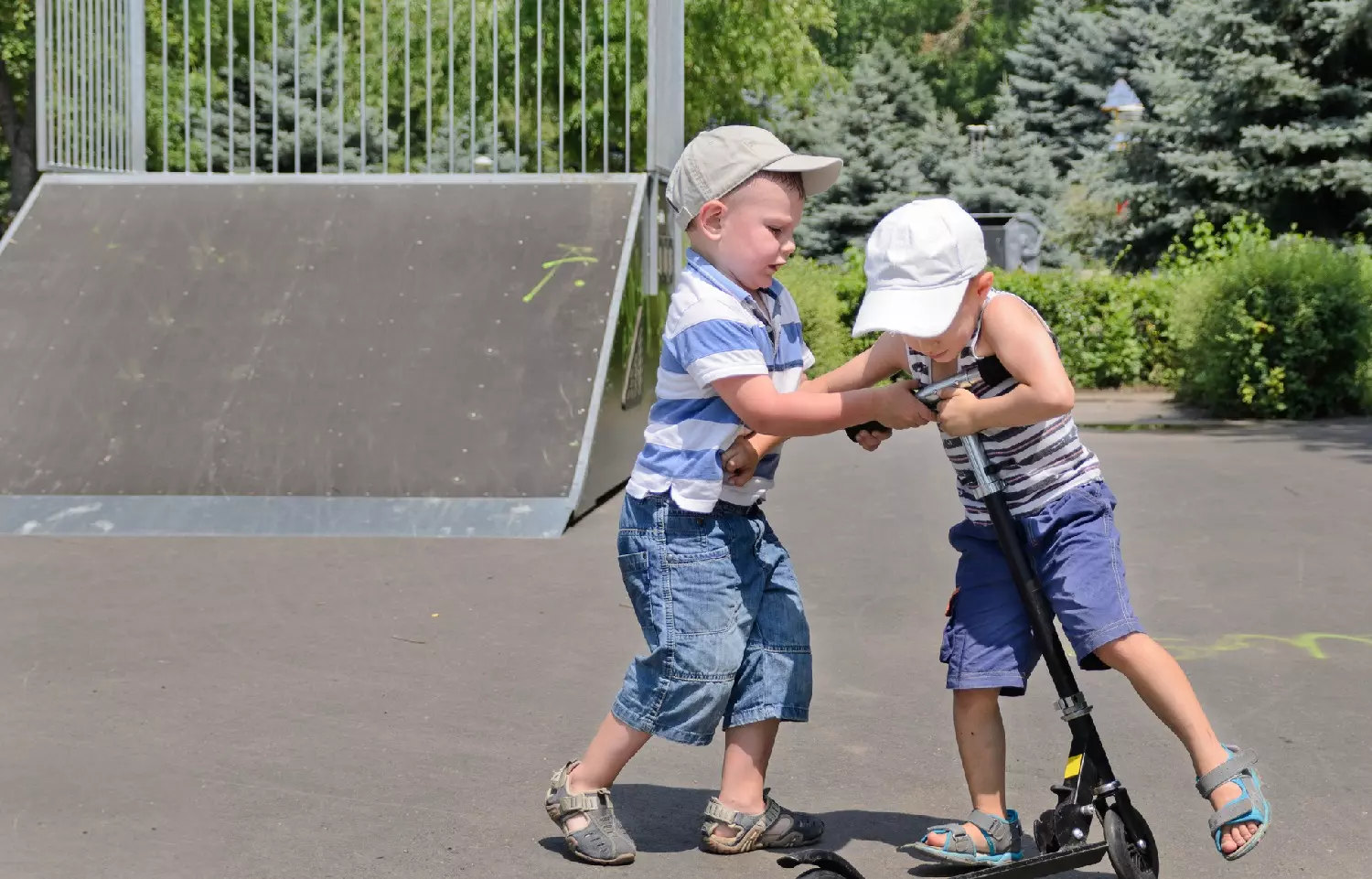 Two boys fighting over a scooter: ID 32261797 © Ampack | Dreamstime.com