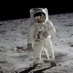 Buzz Aldrin on his moon walk with Armstrong reflected in his visor, photo credit: NASA