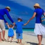 Family in blue clothes walking on a beach: ID 43596644 © Nadezhda1906 | Dreamstime.com