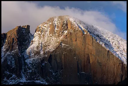 Mountain cliff face lit by morning light, photo credit: Pat Mingarelli