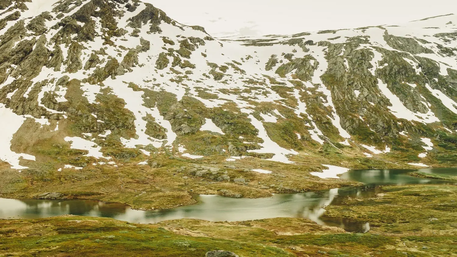Melting snow with boggy pools below a mountain slope in Norway: ID 110461699 © Anetlanda | Dreamstime.com
