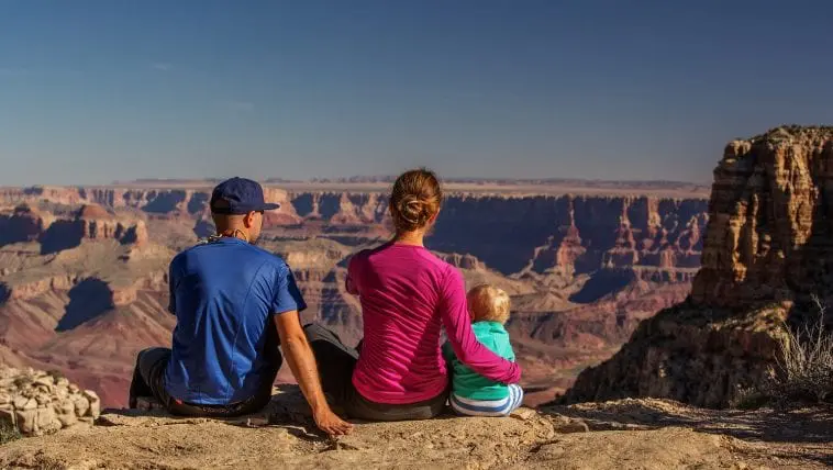 Family facing the Grand Canyon: Photo 111806279 © Anna Dudko | Dreamstime.com