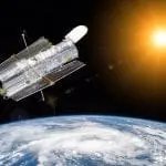 Hubble telescope above earth, composited by: Photo 62060786 © Photojogtom | Dreamstime.com