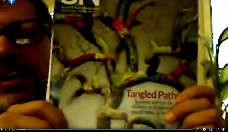 Dr. Jackson with scientific journal cover video still