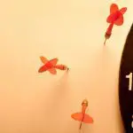 Darts in the wall instead of the target: Photo 30427503 / Missed Target Arrows © Sergii Gnatiuk | Dreamstime.com