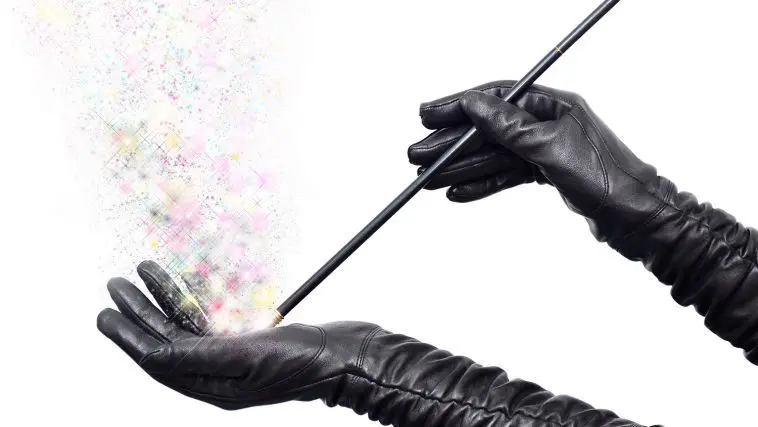 Black-gloved hands making fairy dust with a wand: Photo 21947216 / Fairy Wand © Ruletkka | Dreamstime.com