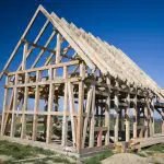 Wooden house framework in a field: Photo 4986419 © Sebastian Czapnik | Dreamstime.com