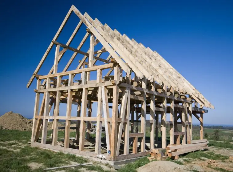 Wooden house framework in a field: Photo 4986419 © Sebastian Czapnik | Dreamstime.com