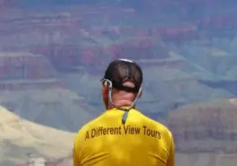 Jon-Sitting-on-Rim-gold-shirt