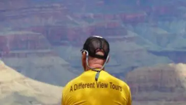 Jon-Sitting-on-Rim-gold-shirt