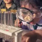 Children doing a chemistry experiment with test tubes: ID 118113363 © Khunaspix | Dreamstime.com