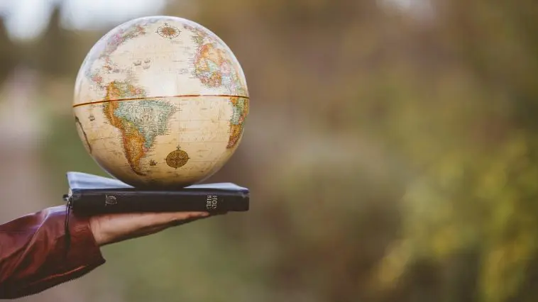 Globe on a Bible: ID 161769582 | Bible Globe © Wirestock | Dreamstime.com