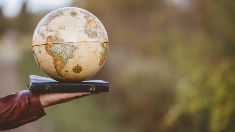 Globe on a Bible: ID 161769582 | Bible Globe © Wirestock | Dreamstime.com