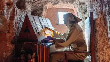 Figure of a monk copying in a cave monastery: ID 365170416 © Agustín Orduña Castillo | Dreamstime.com