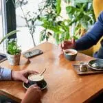 Men having a conversation at a cafe table: ID 460846786 © Anatoliygleb | Dreamstime.com