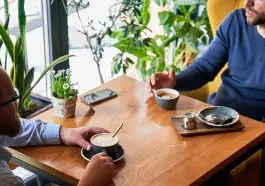 Men having a conversation at a cafe table: ID 460846786 © Anatoliygleb | Dreamstime.com