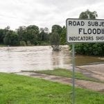 Road subject to Flooding sign with flooded road: ID 93023822 © Grey 18 | Dreamstime.com