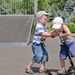 Two boys fighting over a scooter: ID 32261797 © Ampack | Dreamstime.com