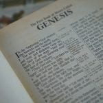 Bible open to the first page of Genesis