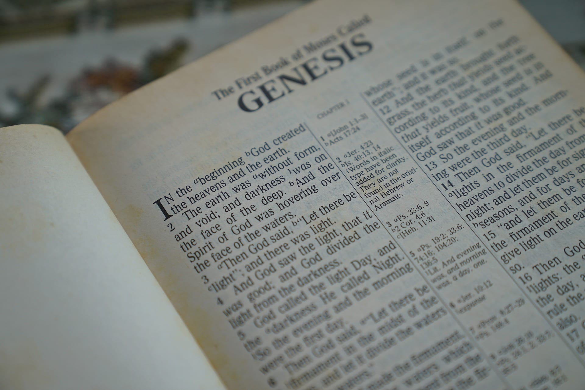 Bible open to the first page of Genesis