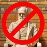 Darwin Statue with a Not Allowed Circle over him