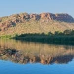 View of a sandstone hill from the Ord river near Kununurra, Western Australia.ID 108417732 © Johncarnemolla | Dreamstime.com