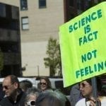 Man protesting that "Science is Fact not Feeling": ID 96219552 © Tracy King | Dreamstime.com