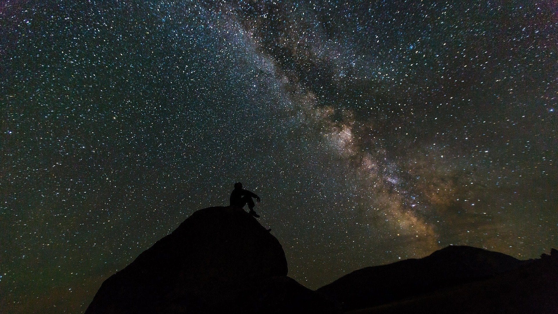 Silhouette of man gazing at the Milky Way, photo credit: Pixabay