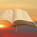 Sunset with an open Bible superimposed over it: Photo 165208206 / Clouds © Photodynamx | Dreamstime.com