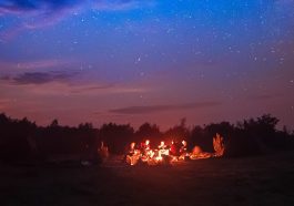 People grouped around campfire by night: Photo 84221874 / Campfire © Roksana Bashyrova | Dreamstime.com