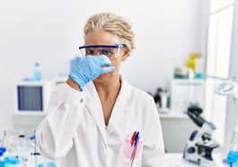 Scientist smelling something gross: Photo 239812848 © Aaron Amat | Dreamstime.com