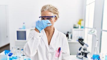 Scientist smelling something gross: Photo 239812848 © Aaron Amat | Dreamstime.com
