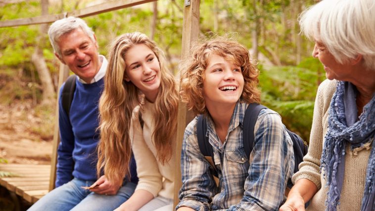 Grandparents and teens sitting outdoors: Photo 59926486 © Monkey Business Images | Dreamstime.com