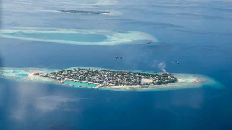 Maldives atolls from the air: Photo 73134036 © BiancoBlue | Dreamstime.com