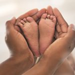 Baby feet with mother's hands: Photo 241438507 © Yuri Arcurs | Dreamstime.com