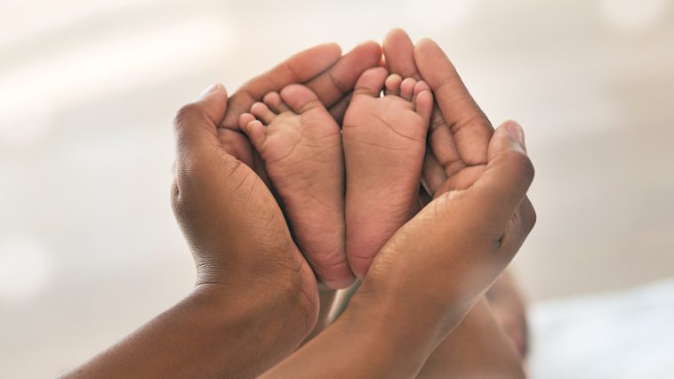 Baby feet with mother's hands: Photo 241438507 © Yuri Arcurs | Dreamstime.com